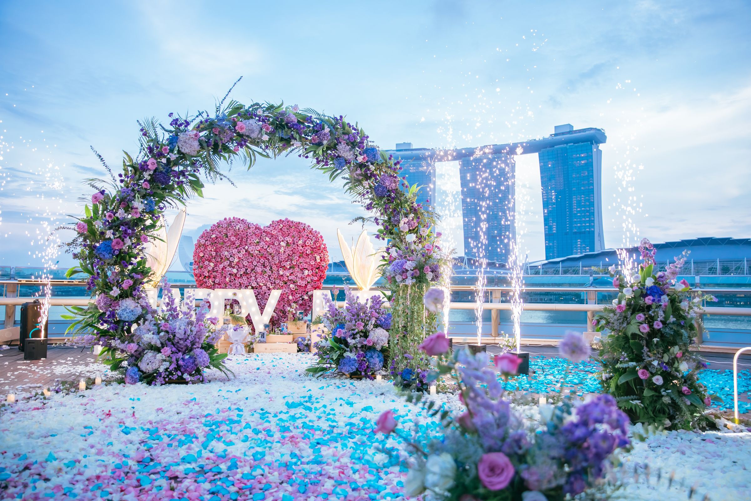 Floral heart arch for a proposal overlooking Marina Bay Sands