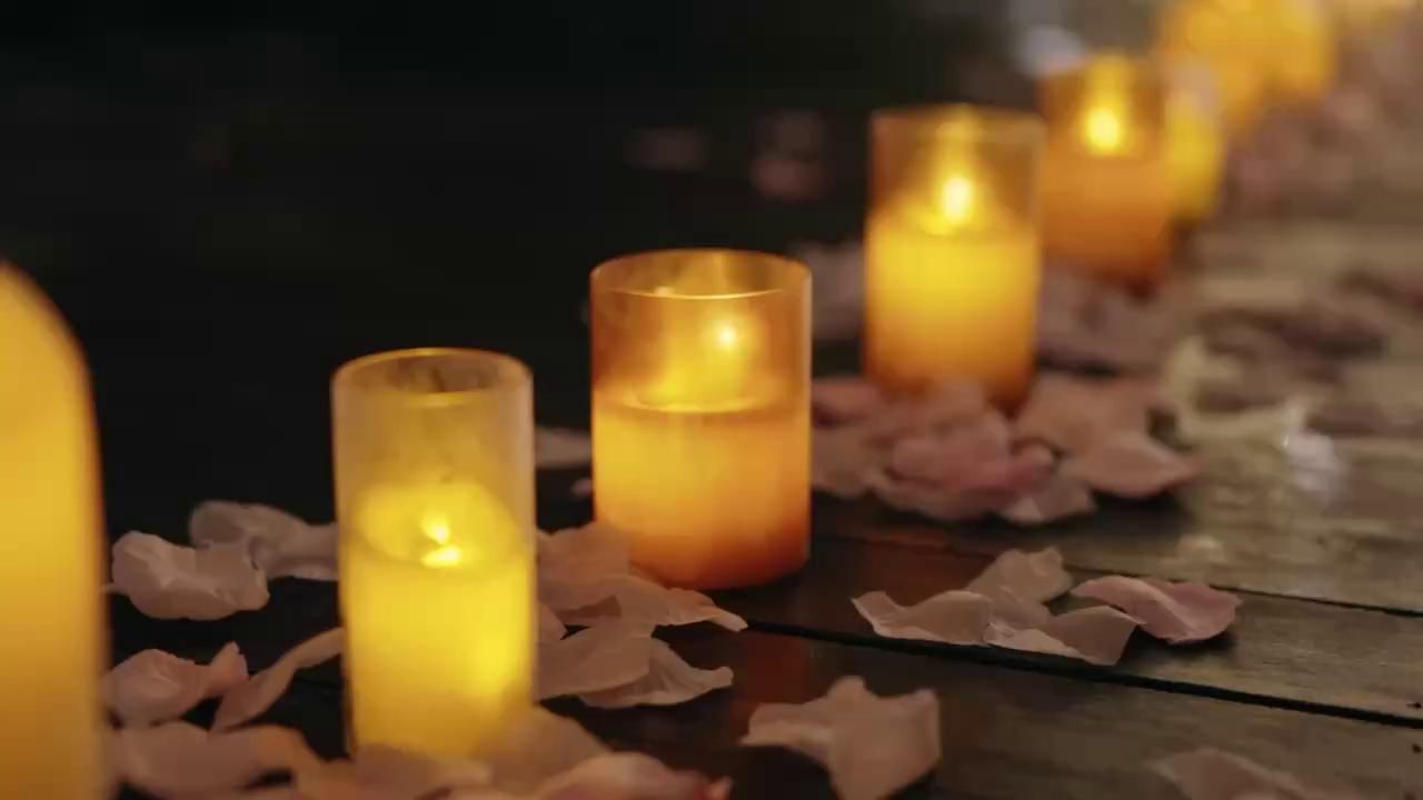 Candles and rose petals on a table