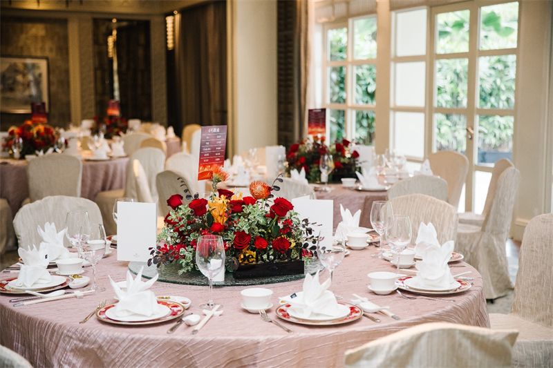 Banquet tables with red centrepieces